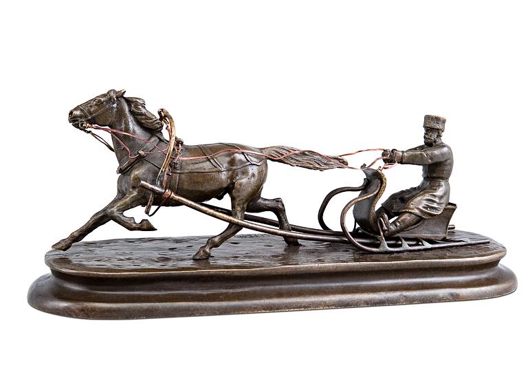 A SCULPTURE, Man in a horse sleigh.