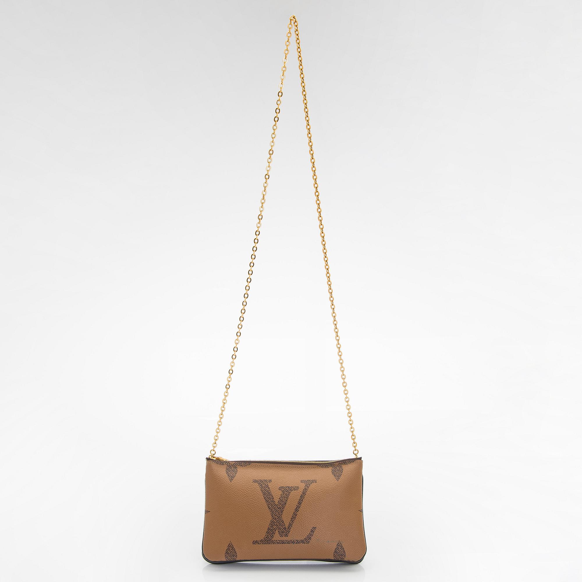 Louis Vuitton, a 'Double Zip Pochette Monogram Giant Reverse', bag