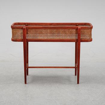 A flowertable with rattan details, late 20th century.