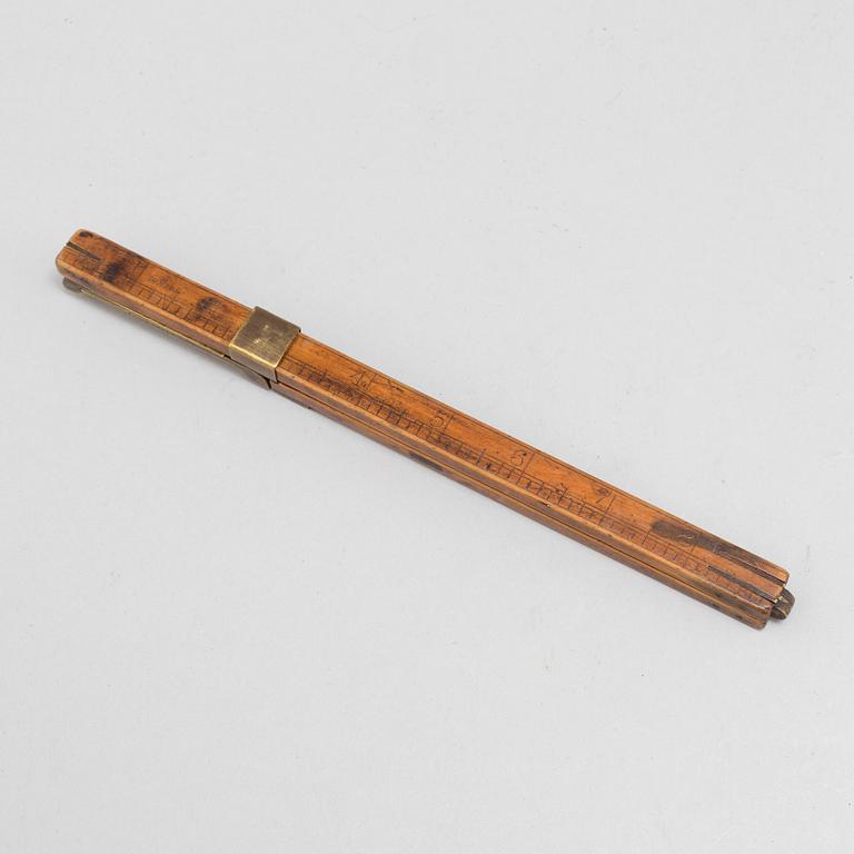 A 19th century wooden measuring stick.