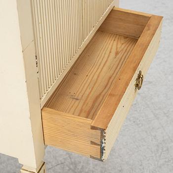 A Gustavian style bedside table, early 20th century.