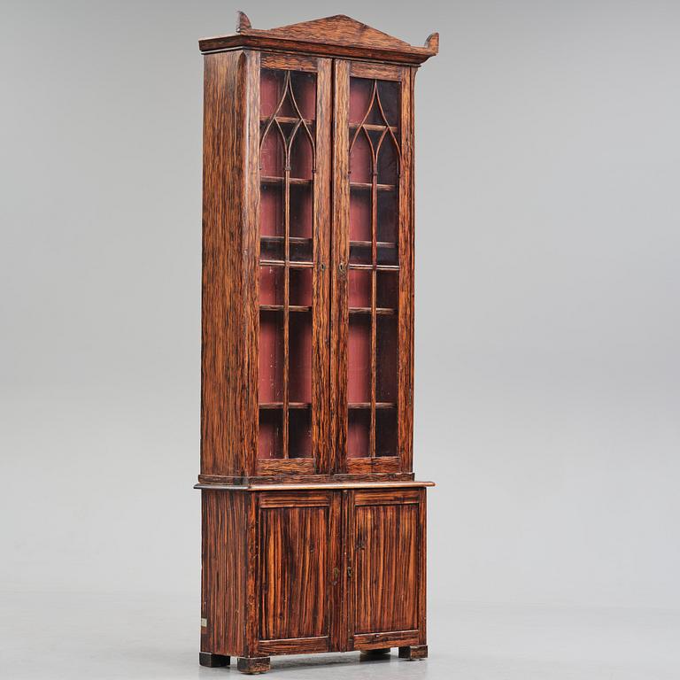 A Swedish faux-boix neo-gothic book cabinet, ca 1830.