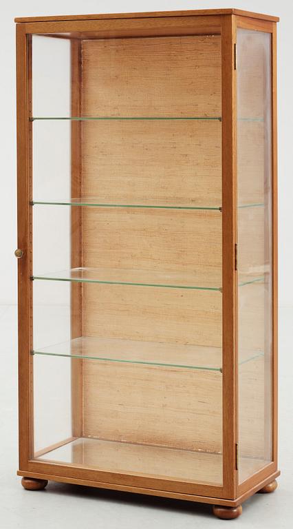 A Josef Frank mahogany and glass cabinet by Svenskt Tenn, model 649.