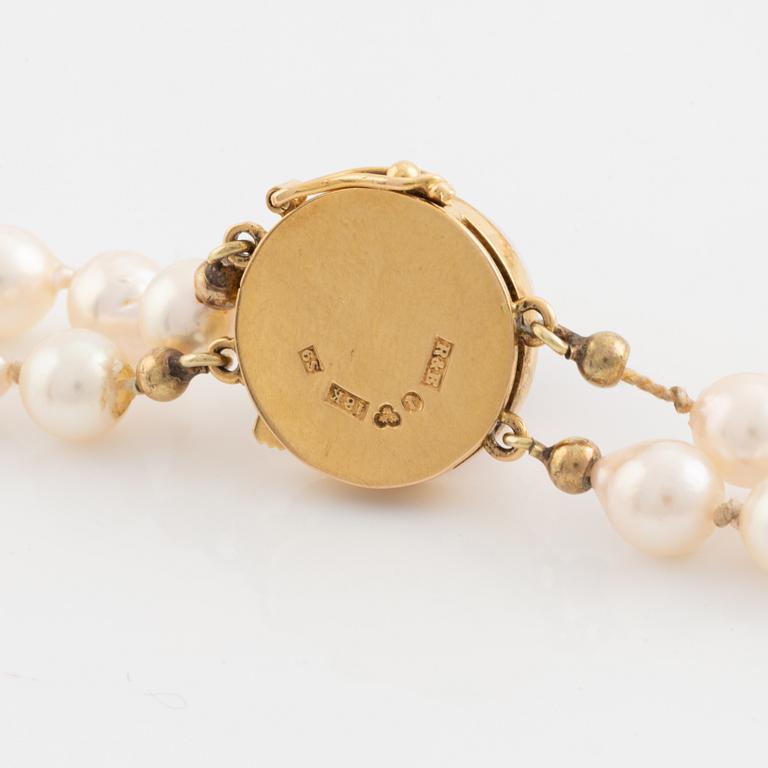 Two strand cultured pearl necklace, 18K gold clasp with rutile quartz.