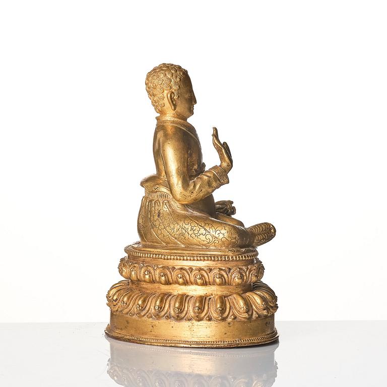 A gilt copper alloy figure of a Lama, most likely Sonam Tsemo, Tibet, probably 16/17th century.