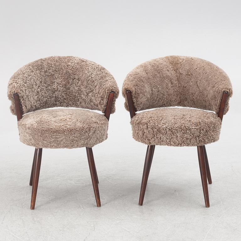 A pair of armchairs, AB Bröderna Biörs Snickerifabrik, mid-20th century.