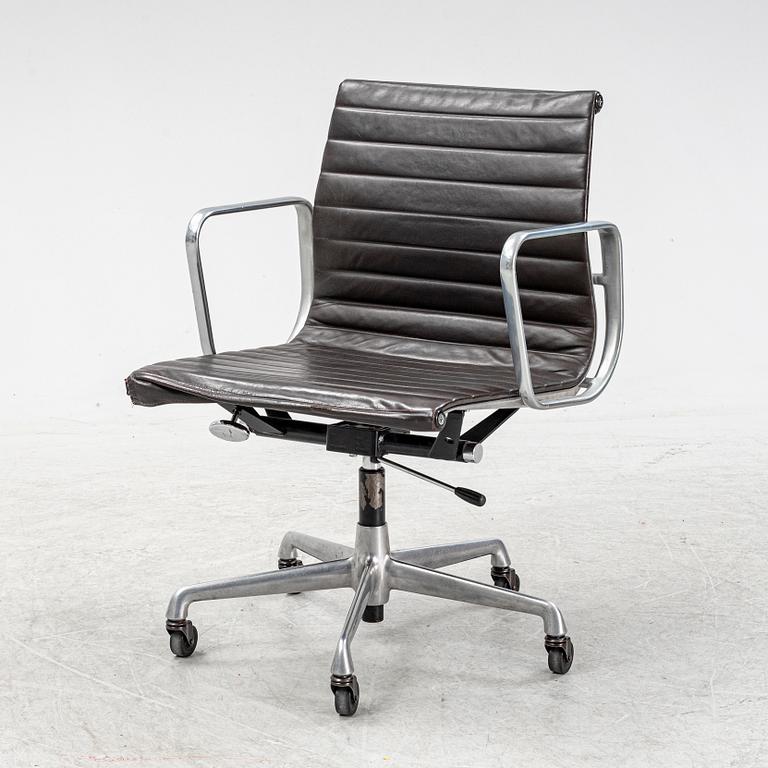 An EA 118 swivel office chair by Charles and Ray Eames for Herman Miller.