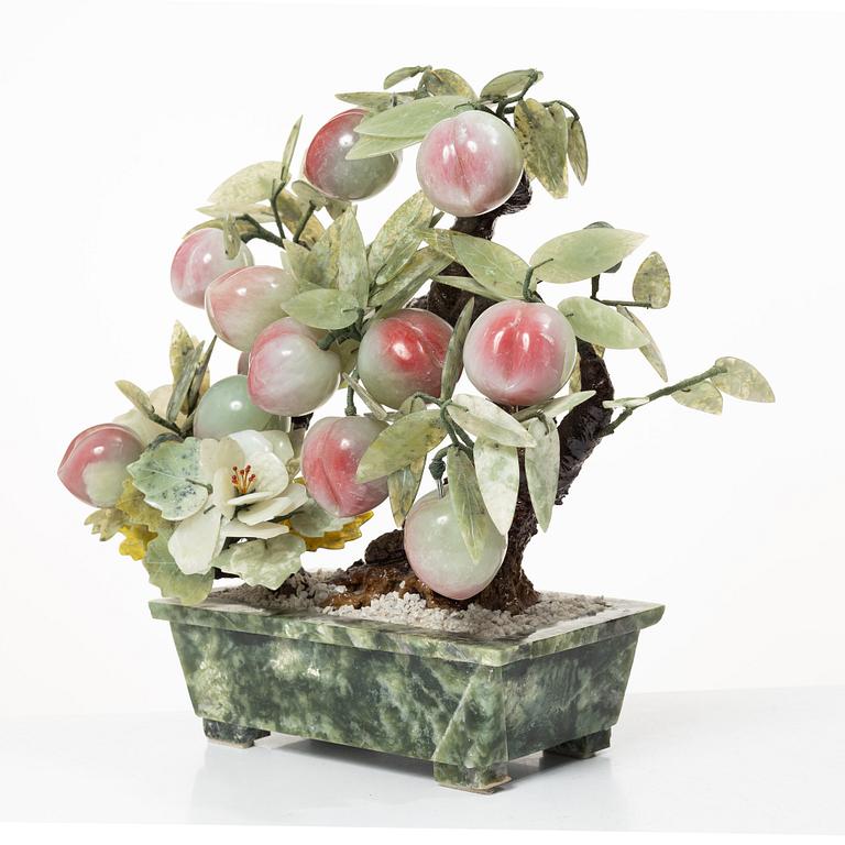A stone table decoration in the shape of a peach tree, China, 20th century.