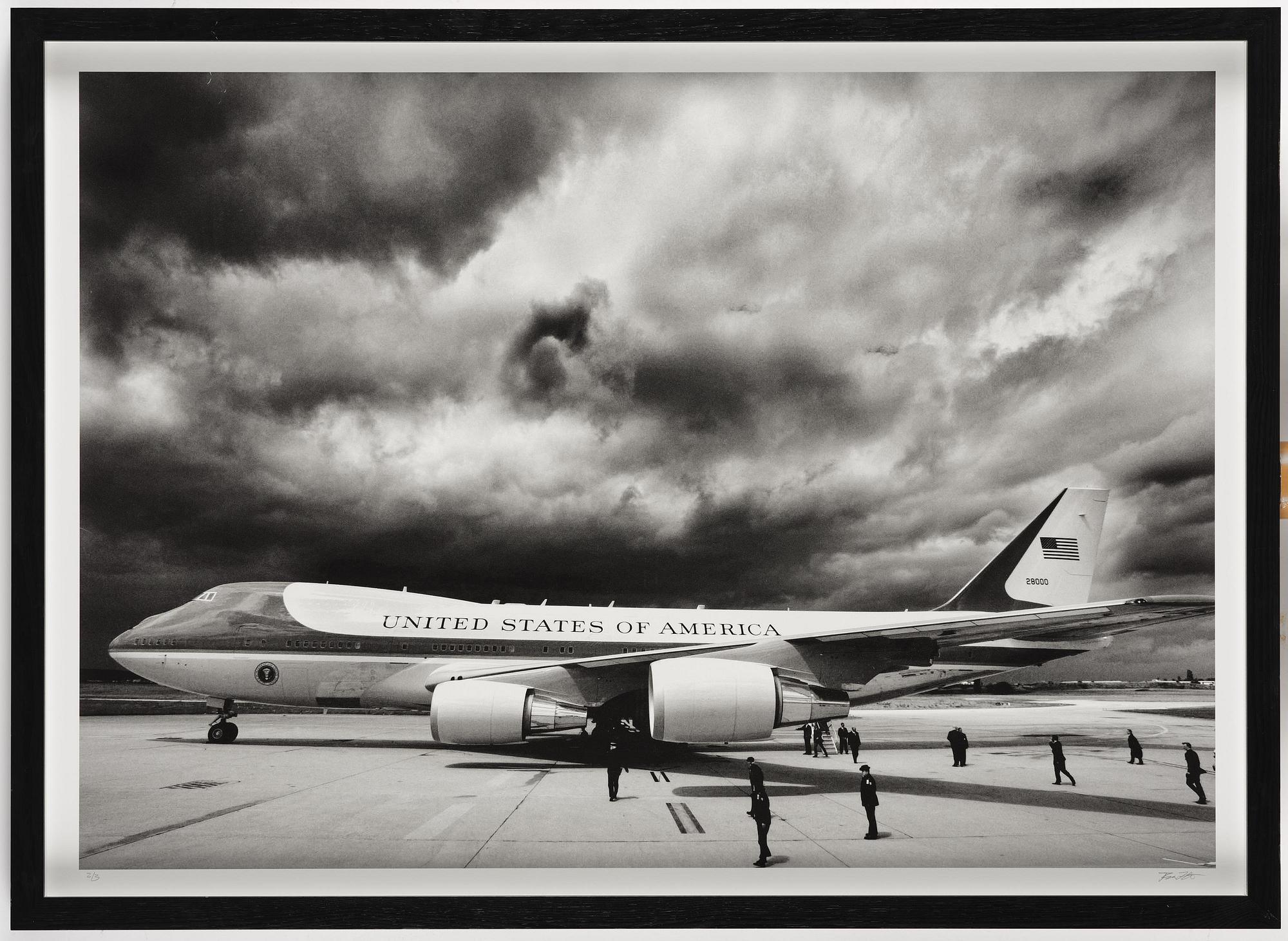 Brooks Kraft, "Storm clouds loom overhead as Air Force One and U.S. President George W. Bush arrive in Paris", 2003.