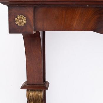 A Swedish Empire mirror and console table, first half of the 19th century.