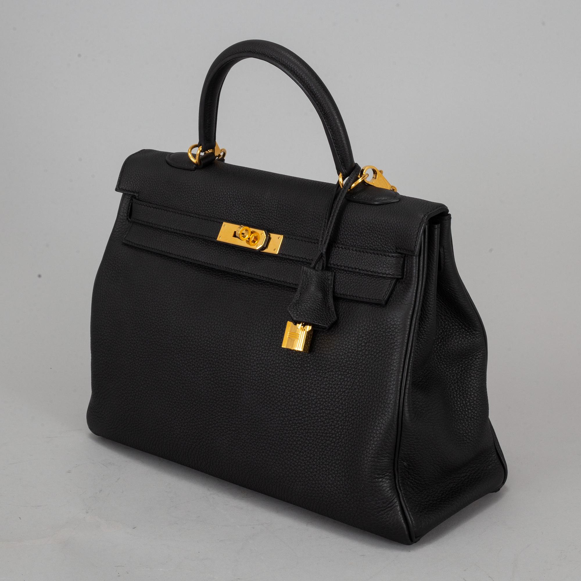 HERMÈS, a 'Kelly 35' black leather bag.