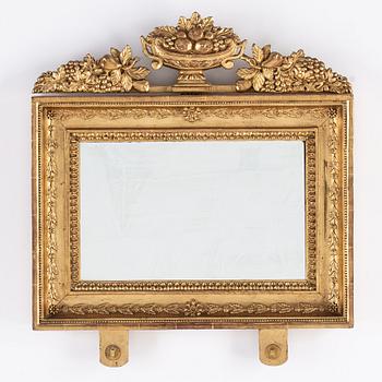 A pair of Swedish Empire mirror wall sconces, first half of the 19th century.