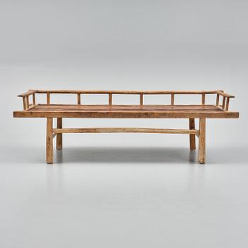 A wooden daybed, South East Asia.