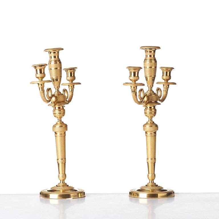 A pair of French Empire three-light candelabra, beginning of 19th century.