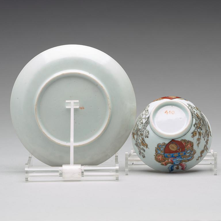 A famille rose armorial cup with saucer, Qing dynasty, 18th Century.