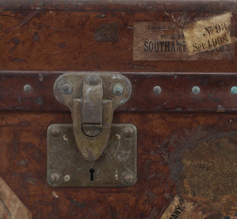 A early 20th cent brown leather trunk by Louis Vuitton.