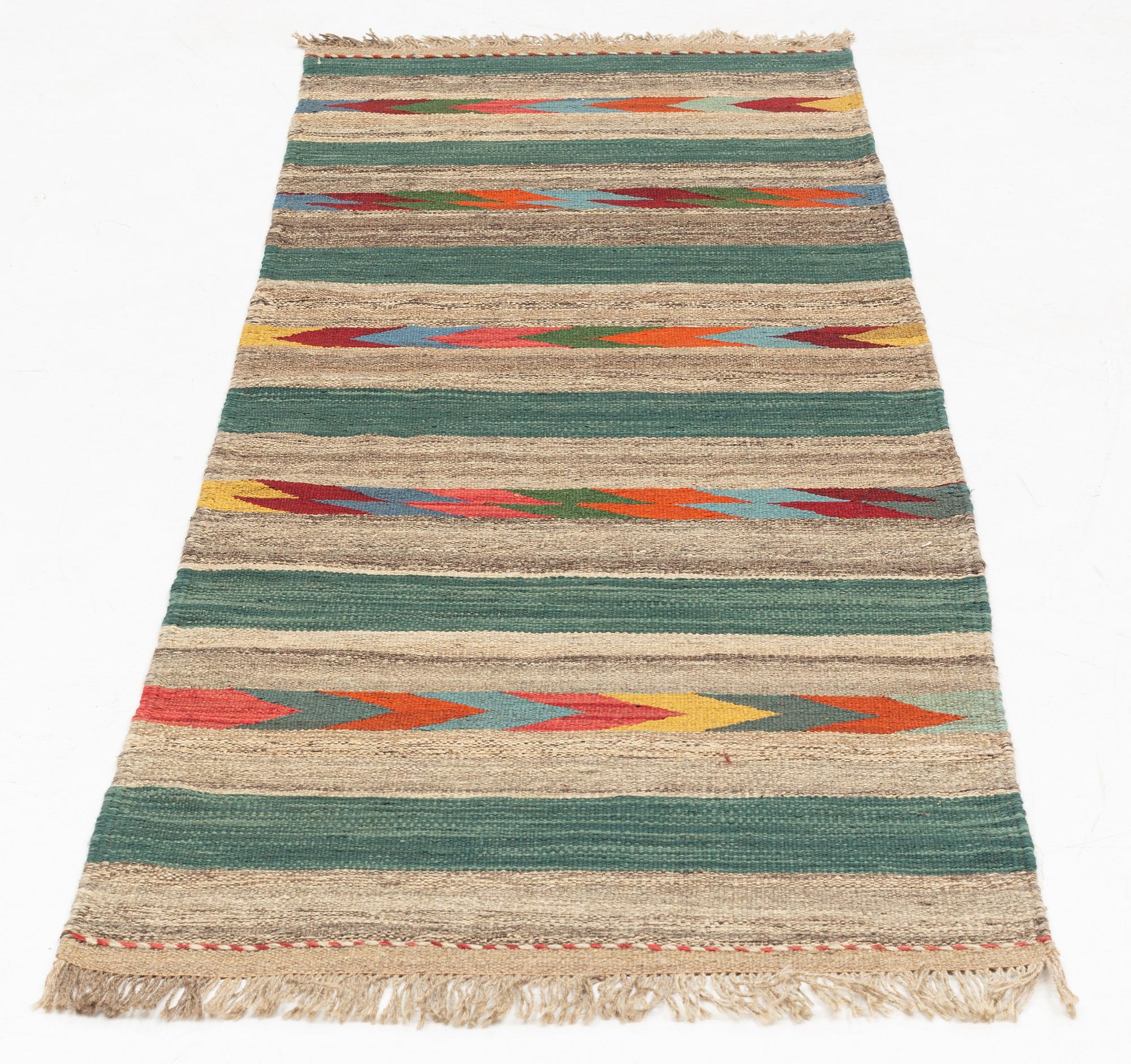 A Kilim runner, c. 213 x 74 cm.