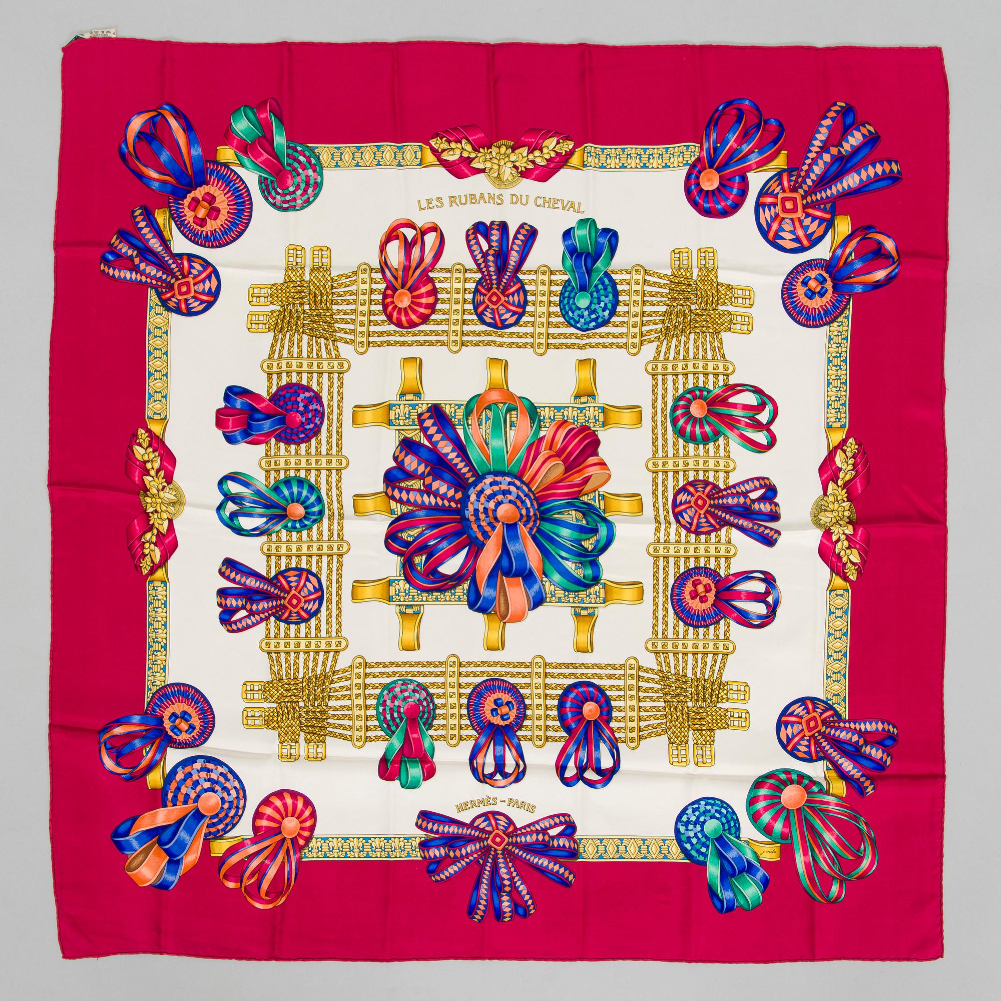 Hermès, a 'Les Rubans du Cheval' silk scarf.
