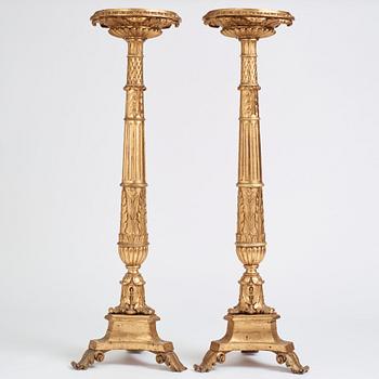 A pair of Swedish Empire giltwood gueridons, Stockholm, first part of the 19th century.