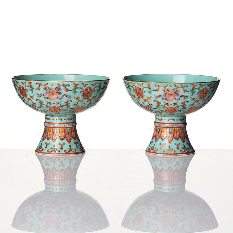 A pair of rare turquoise ground 'baijiaxiang' stemcups, Qing dynasty with Daoguang mark and period (1821-1850).