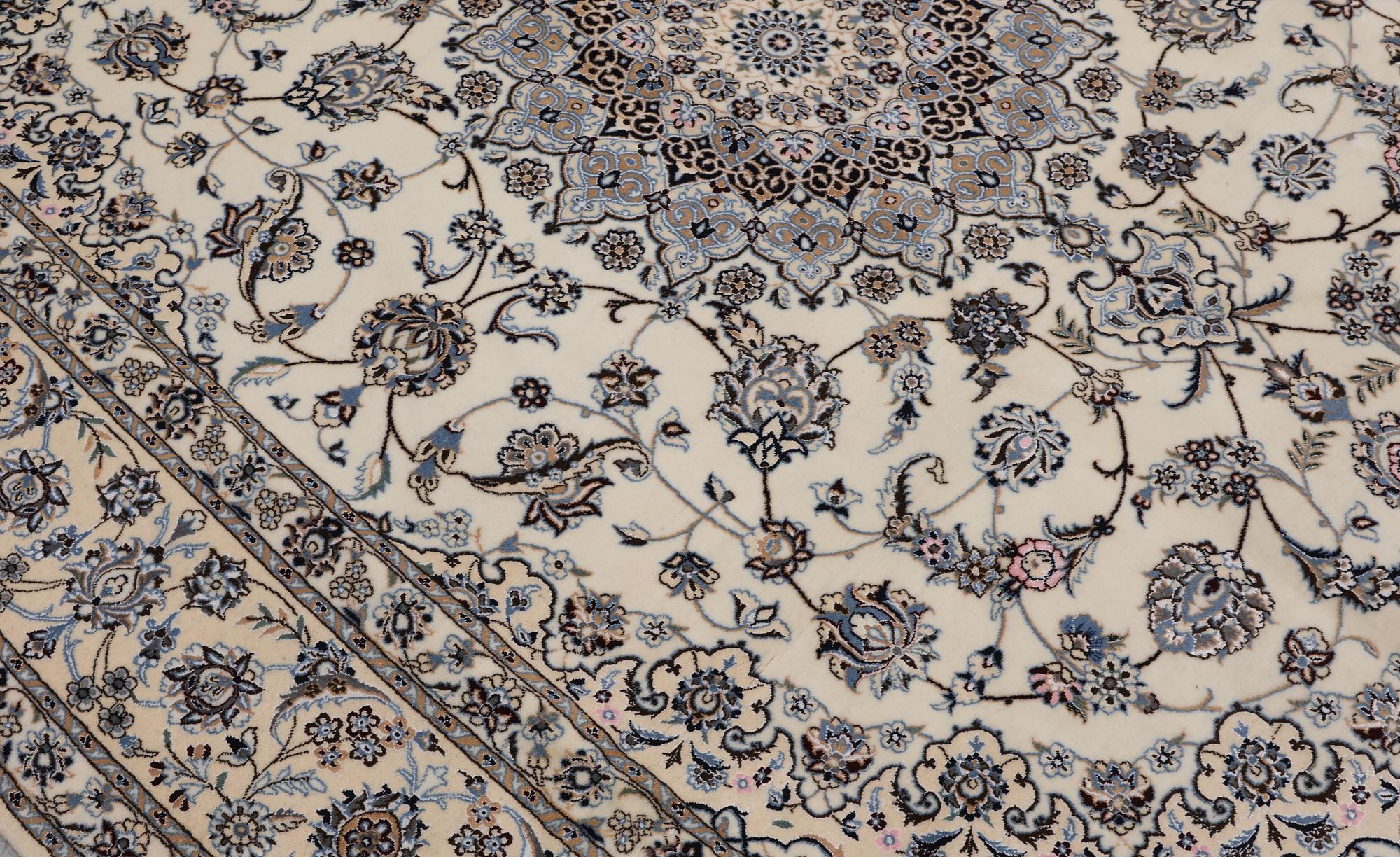 A Nain part silk carpet, 269 x 213 cm.