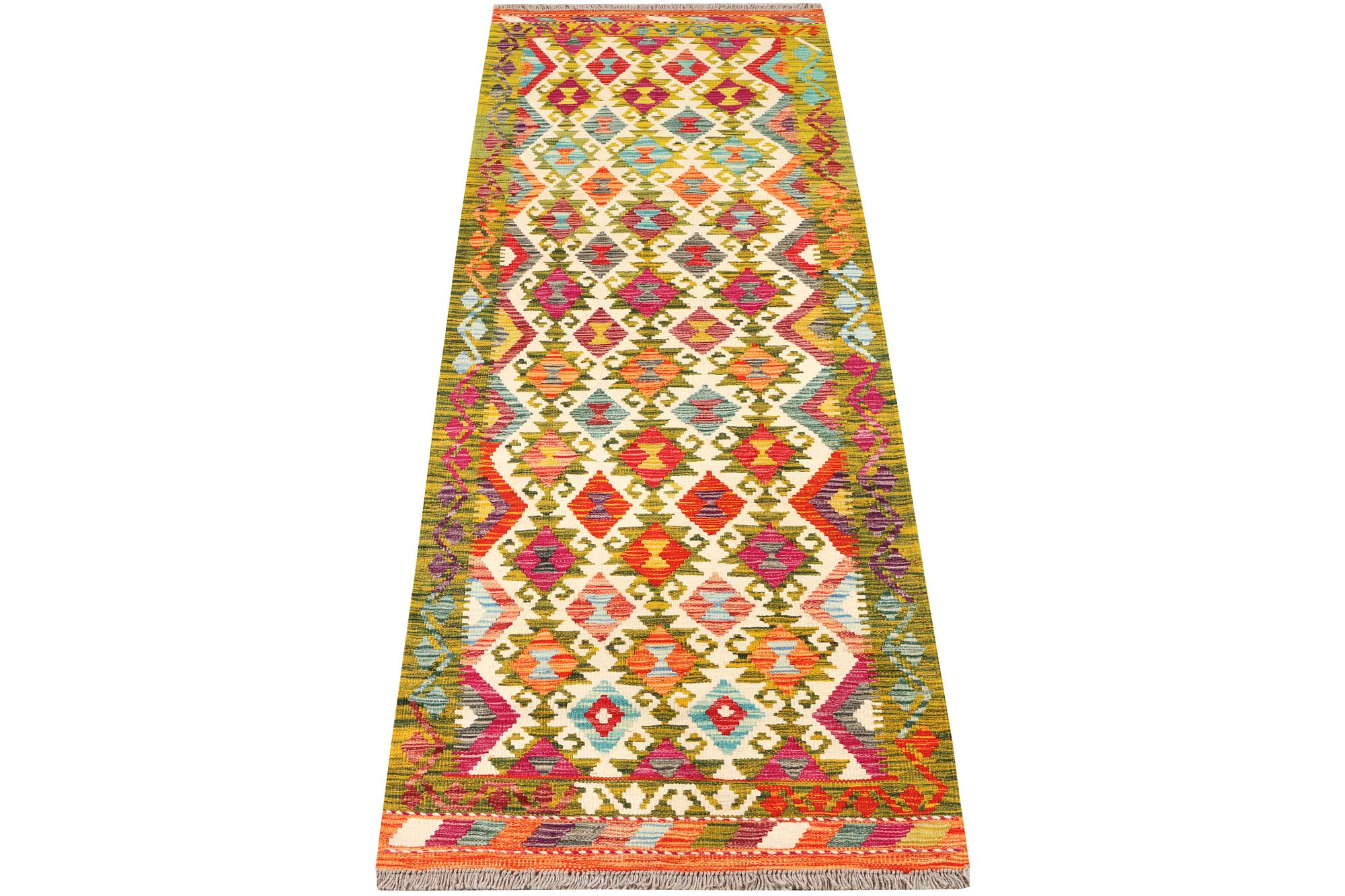 An Afghan kilim rug, c. 246 x 80 cm.