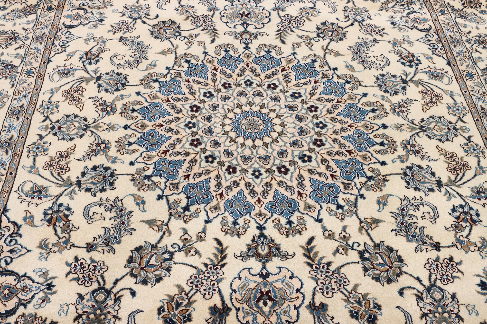 A Nain, part silk carpet, c. 337 x 244 cm.