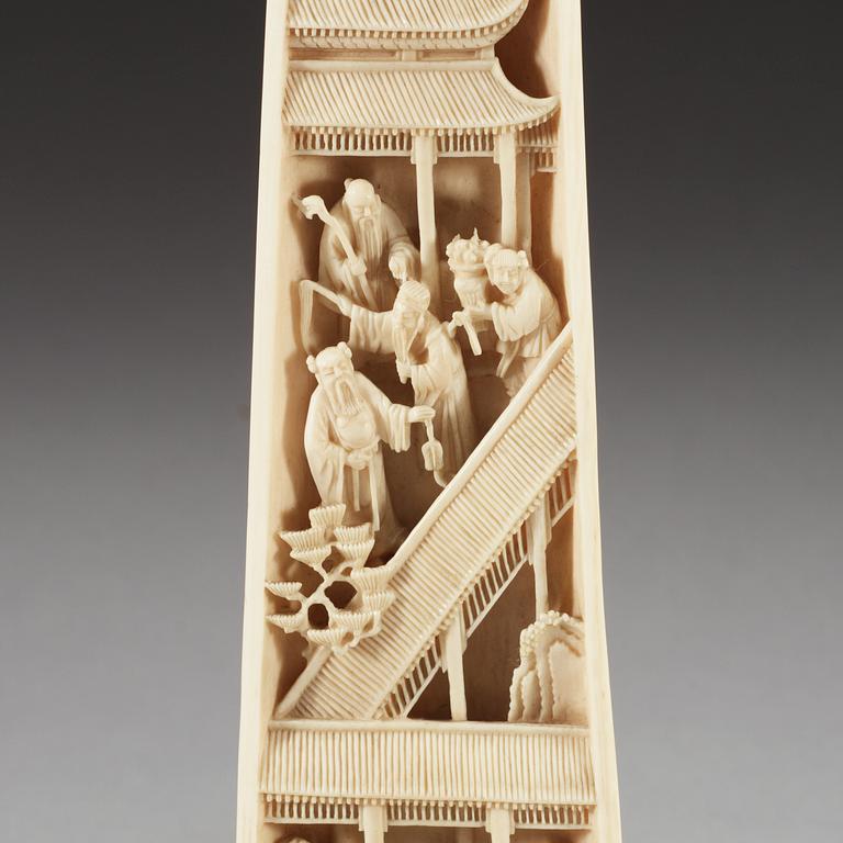 A carved ivory armrest, Qing dynasty.