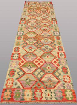 A runner kilim, ca 391 x 88 cm.