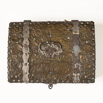 A presumably German baroque repoussé brass writing box, late 17th century.