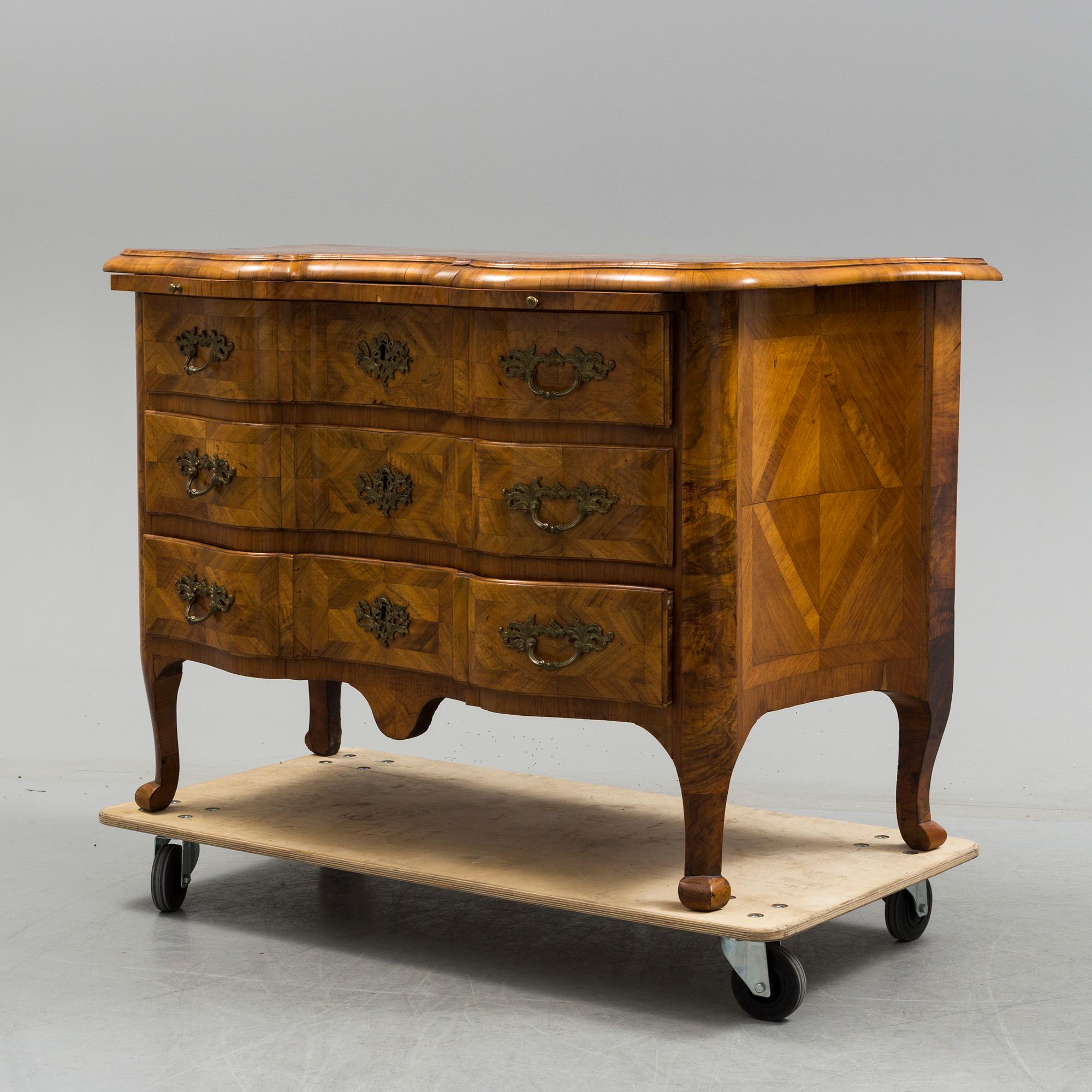 A late baroque mid 18th century chest of drawers by Christian Linning.