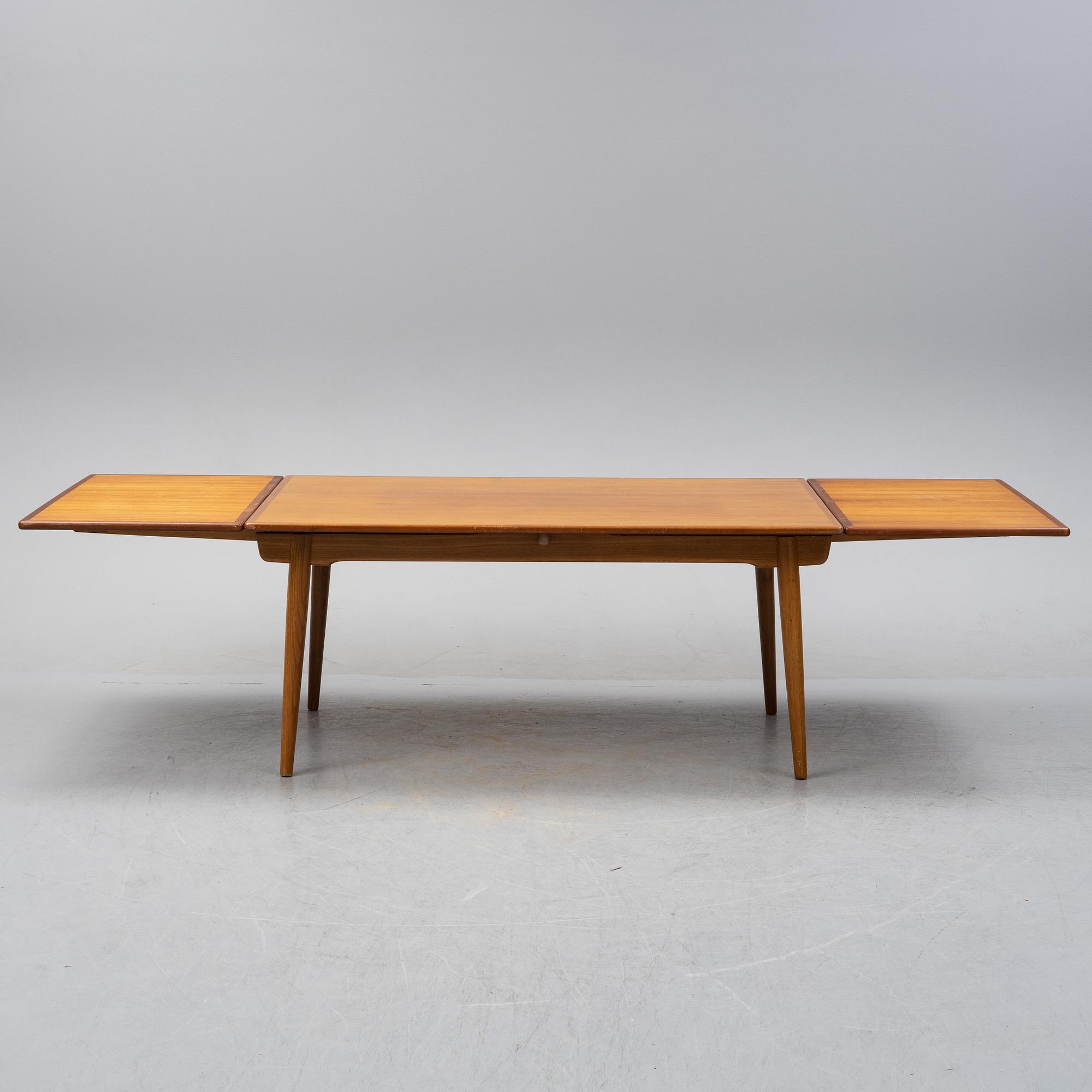 Hans J Wegner, a model 'AT-312' teak veneered dining table, Andreas Tuck, Denmark.