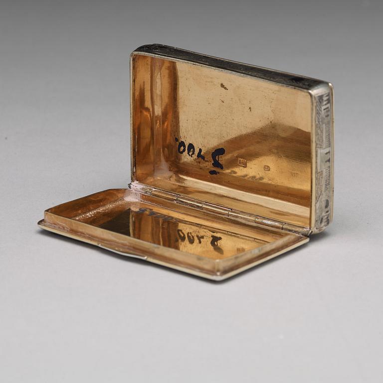 A Russian 19 th century parcel-gilt and niello cigarette-case, makers mark Ivan Kaltikov, Moscow.