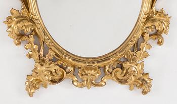 A 20th century Baroque style mirror.