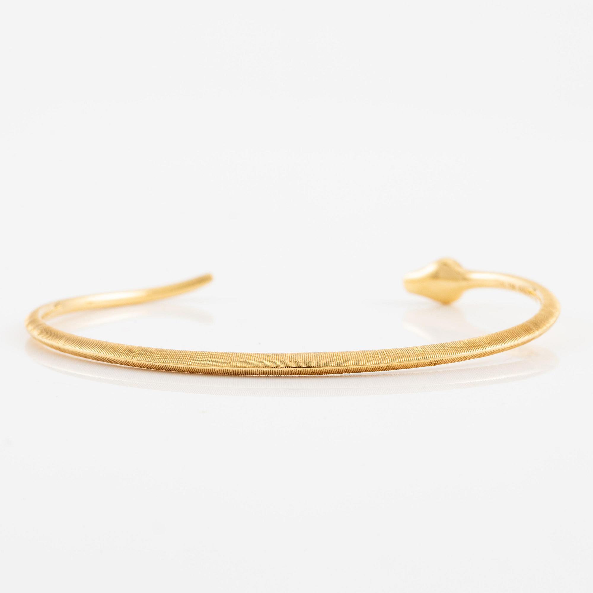 An Ole Lynggaard bracelet 18K gold in the shape of a snake.