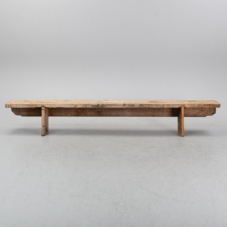 A pine bench, 19th Century.