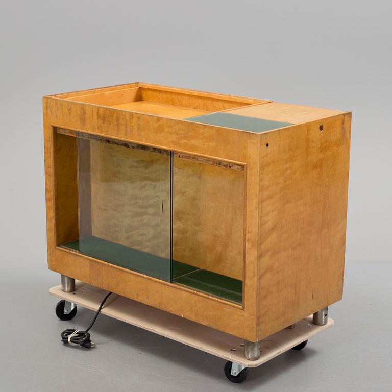 KÖPMANNADISK, 1900-talets mitt.