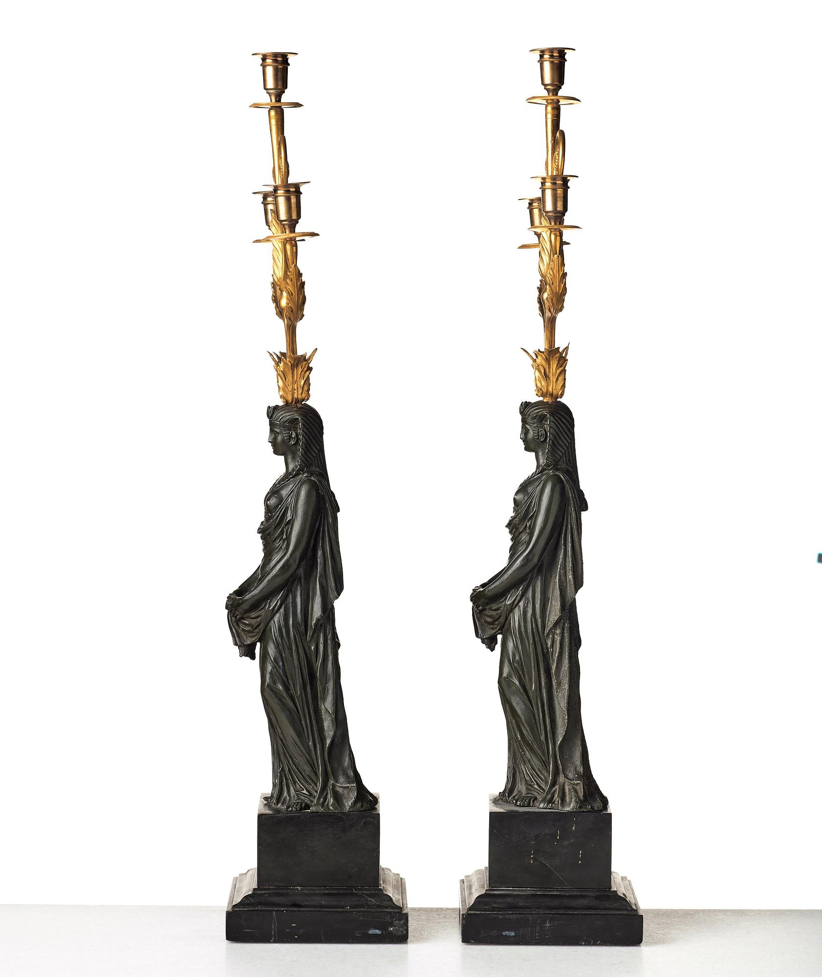 A pair of French Empire early 19th century three-light candelabra.
