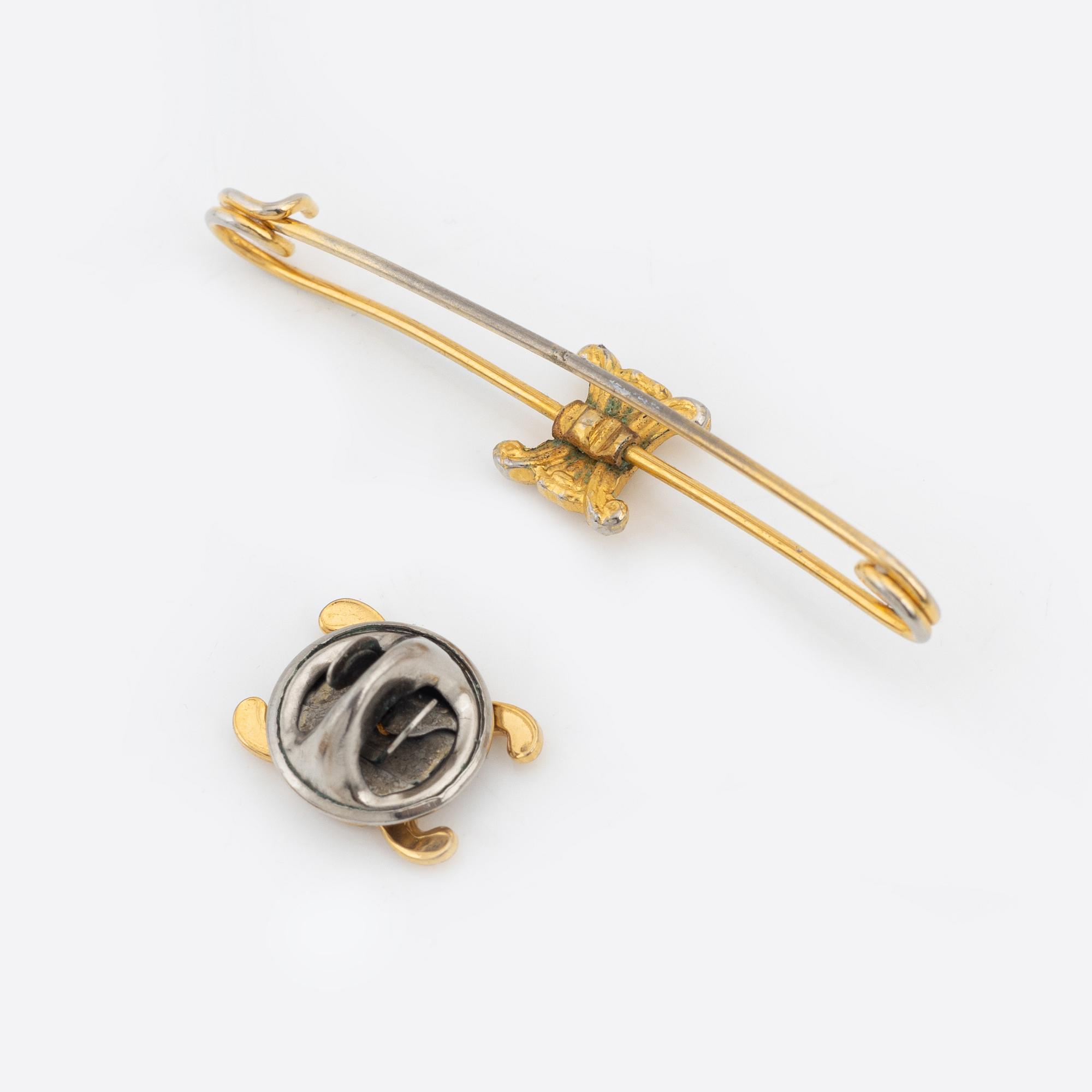 Céline, a set of four gold tone brooches.