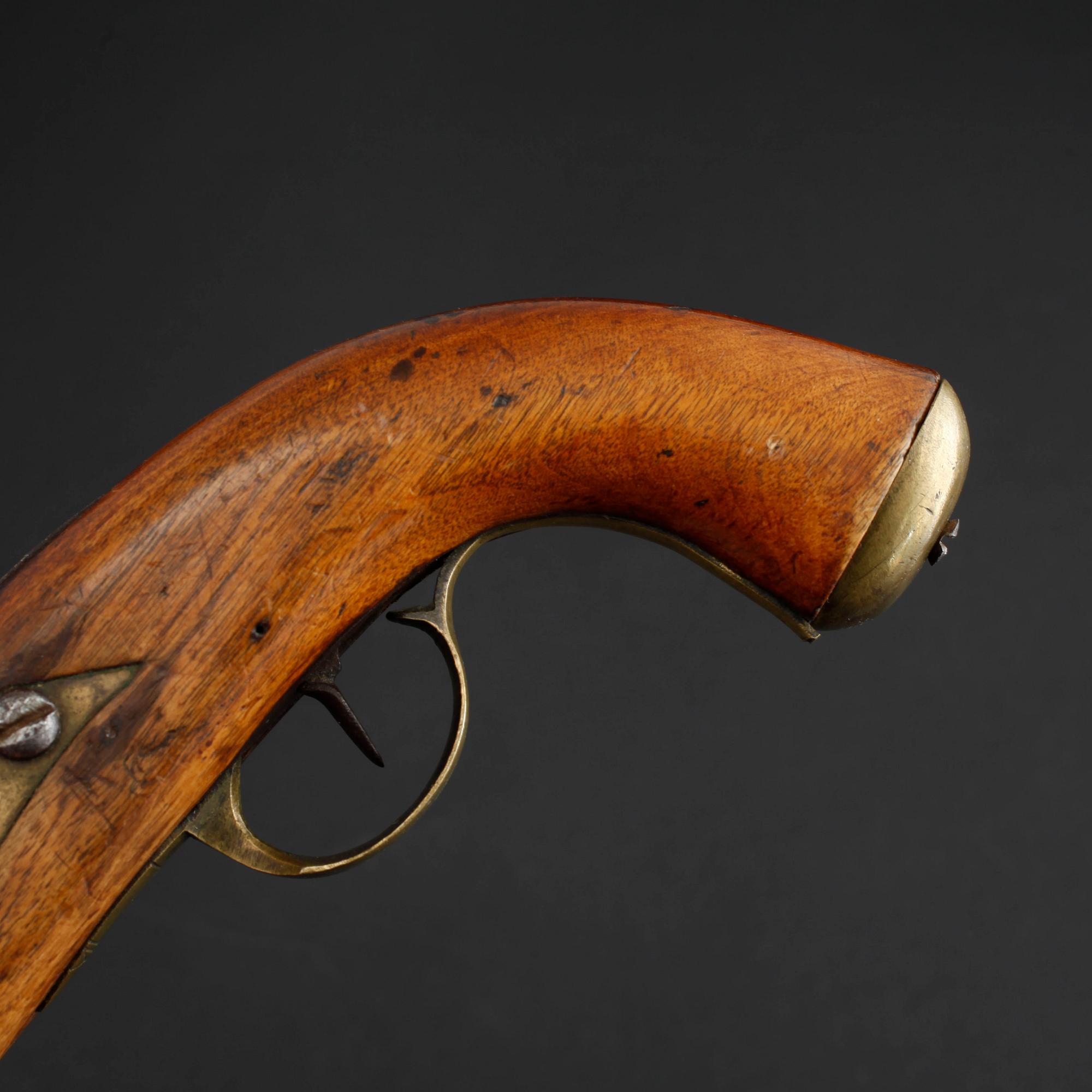 An early 19th century cap lock revolver.