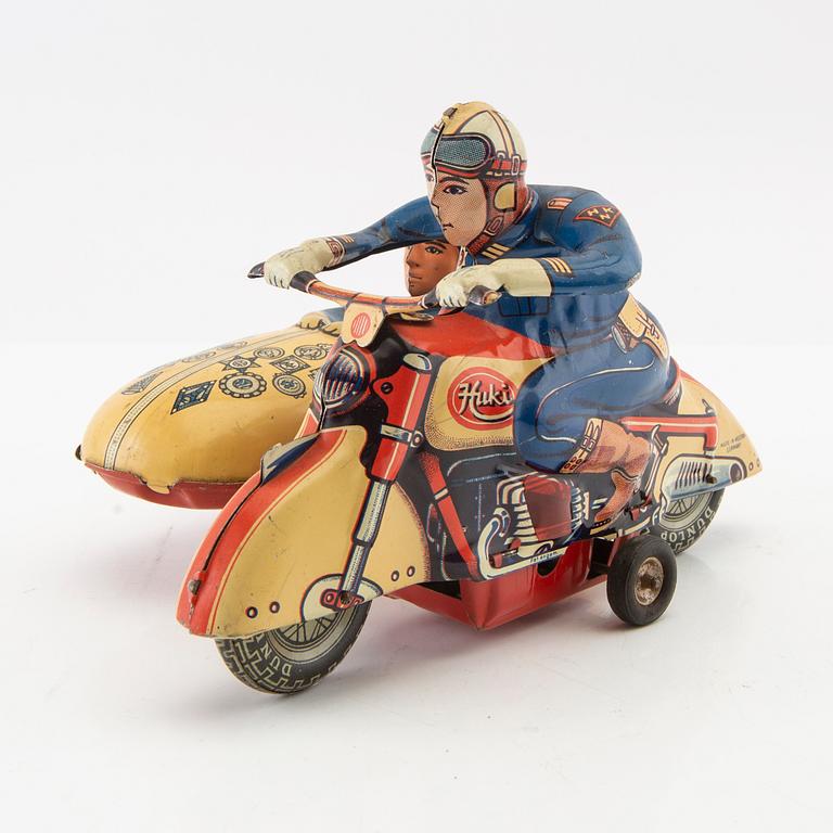 Toy motorcycle with sidecar. Huki Germany mid-20th century lithographed tin.