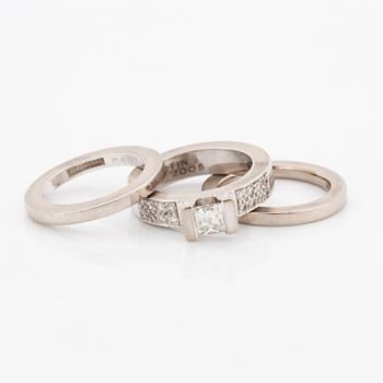Rolf Karlsson, Three rings, 18K white gold with princess-cut and brilliant-cut diamonds, and two band rings.