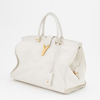 Yves Saint Laurent, a white leather handbag.