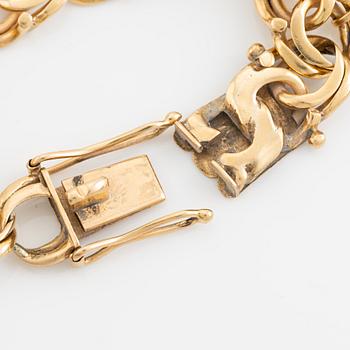 Gold charm bracelet.