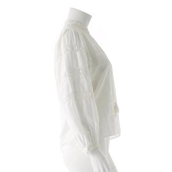 YVES SAINT LAURENT, a white cotton blouse.