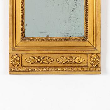 A giltwood Empire mirror by J. P. Holmberg (active in Stockholm 1813 - 1831).