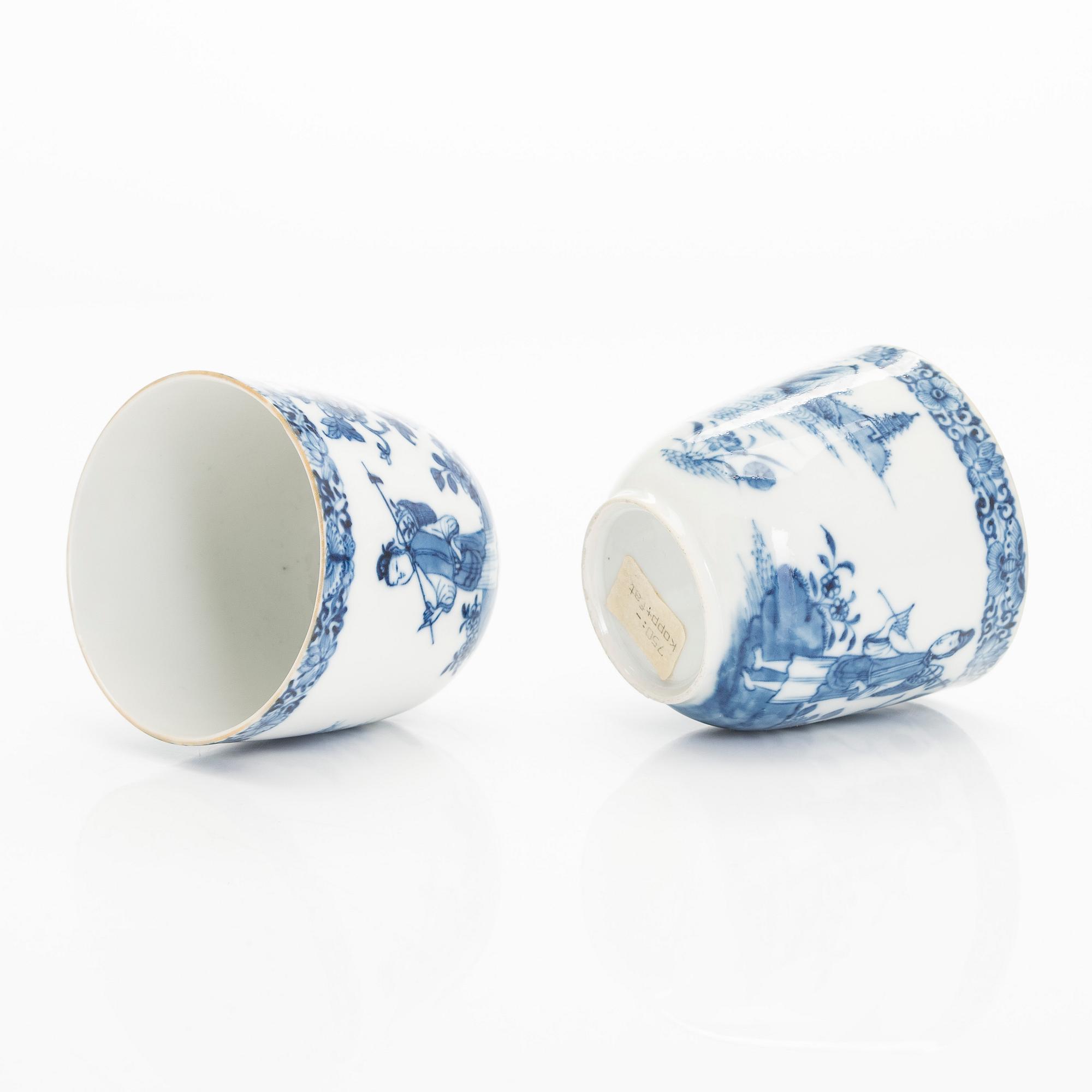 A set of two blue and white 'Chinese Export' tea caddies and four cups with saucers, Qing dynasty, 18th Century.