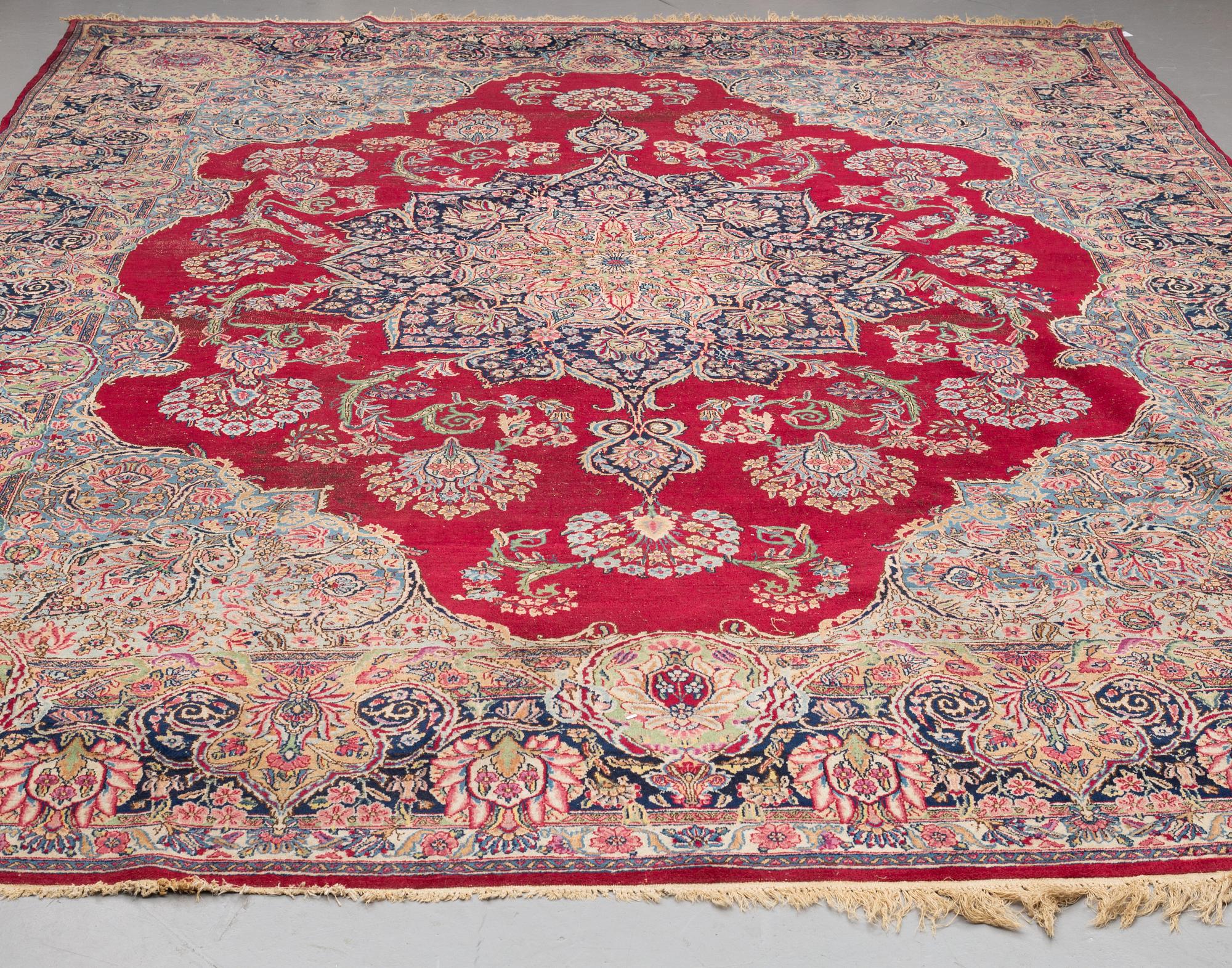 A CARPET, , semi-antique Kerman, ca 431 x 296 cm.