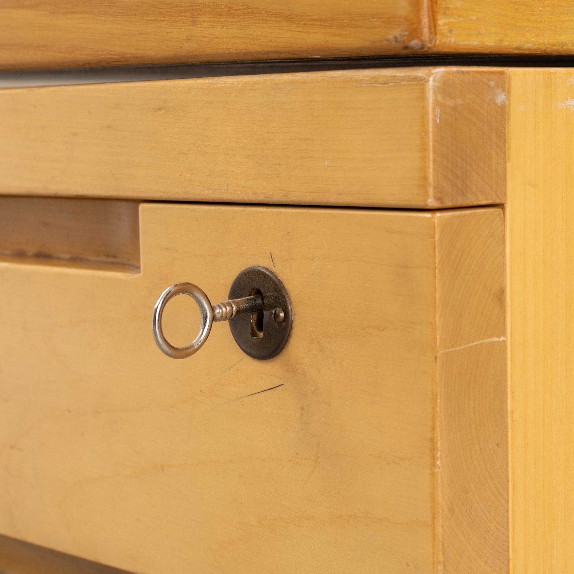 Alvar Aalto, a birch writing desk for Artek, Finland, second half of the 20th century.