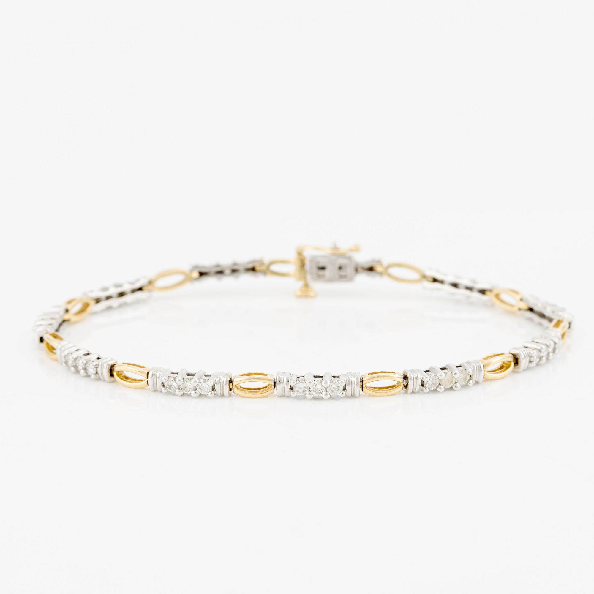 Armlänk, 14K guld med briljantslipade diamanter.